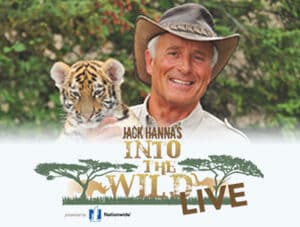 Jack Hanna is holding a Tiger cub in his arms. The Logo for the show is below him on a white background. The logo has trees on the sides of the text.
