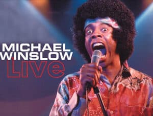 Classic photo of Michael Winslow doing standup with his microphone